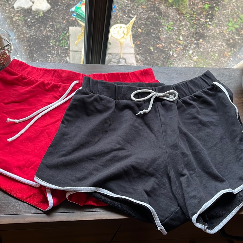 2 pairs of short gym shorts,black and red with draw string adjustable waistband